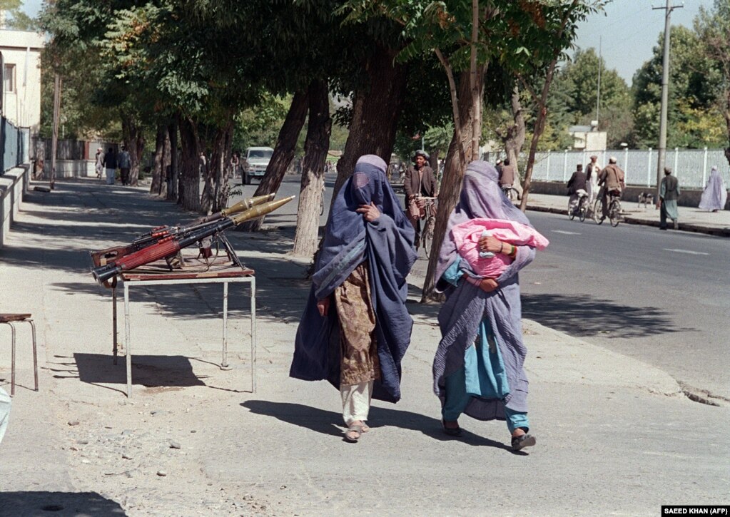 Two Afghan women dressed in burqas in Kabul in 1996. Taliban Reverts