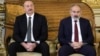 Azerbaijani President Ilham Aliyev (left) and Armenian Prime Minister Nikol Pashinian. "This is an issue between our two countries, and we have to solve it ourselves," the Azerbaijani president said in a January 10 interview.