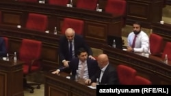 Armenia - Investigative Committee chief Argishti Kyaramian (left) and parliament deputy Hovik Aghazarian argue during a parliamentary hearing, Yerevan, October 15, 2024.