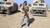 AFGHANISTAN -- Afghan security officials patrol during an operation against the Islamic State militants, in Khogiani district of Nangarhar province, December 10, 2017