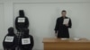 Скриншот сцены веб-сериала "Судья Грэмм" (YouTube-канал "Судья Грэмм"). Карим Ямадаев — справа в мантии судьи