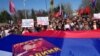Pro-Russian activists hold a large Russian flag bearing a portrait of late Soviet dictator Josef Stalin as they take part in a rally in Odesa, Ukraine. (AFP/Aleksei Kravtsov)