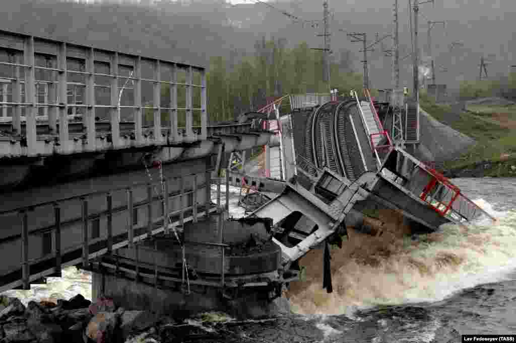 A view shows a railway bridge across the Kola River that collapsed after its foundations were washed away by rapidly melting snow and strong flows of water, near Murmansk, on June 3. (TASS/Lev Fedoseyev)