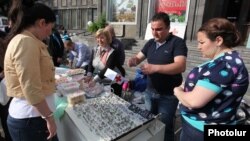 Armenia - Syrian Armenians sell their handmade products at a fair in Yerevan, 20May2014.