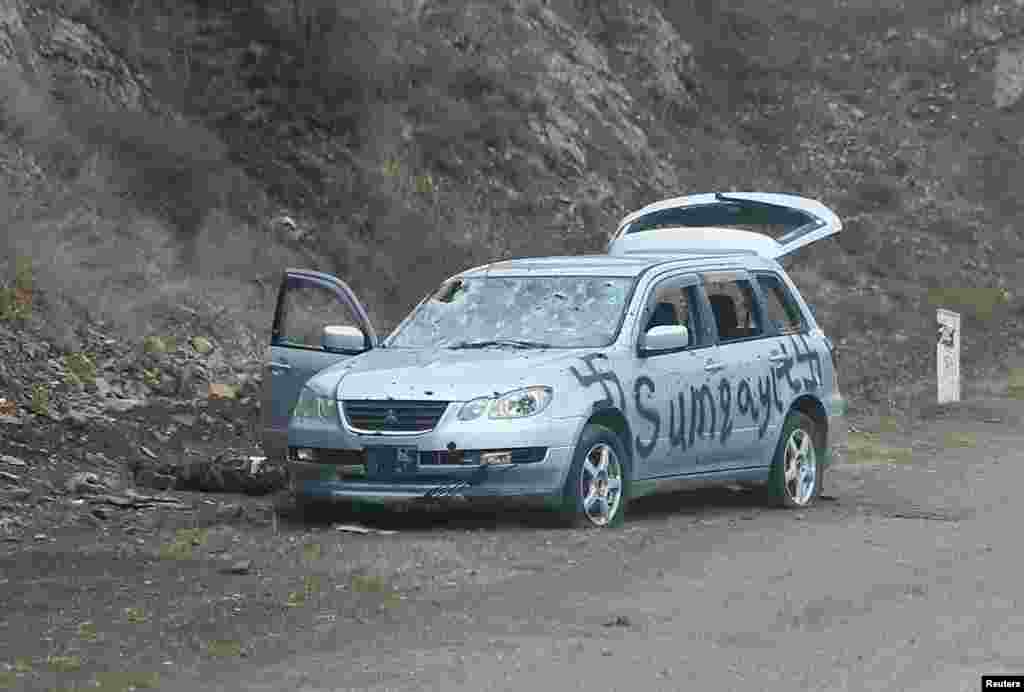 A car spray-painted with swastikas and the word &quot;Sumqayit.&quot;&nbsp; The Azerbaijani town of Sumqayit was the scene of an infamous massacre in 1988, when dozens of ethnic Armenians were killed amid unrest over Nagorno-Karabakh.&nbsp;