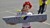 A young girl was one of but a handful of participants in a demonstration in Saint-Nazaire in June against the sale of French-built Mistral warships to Russia.