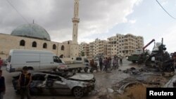 Syria -- People inspect the damage after an explosion occurred outside a mosque in the rebel-controlled city of Idlib, May 27, 2016
