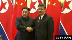 Kim Jong-un i Xi Jinping, Peking