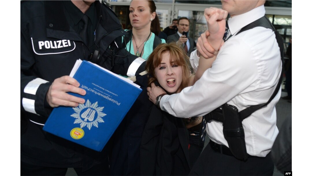 "It wasn't the German police but Putin's security who handled us harshly," says Shevchenko.