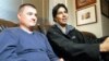 U.S. Army Captain Matt Zeller (left) with translator Janis Shenwari, whom he credits for saving his life in Afghanistan in 2008, during an interview in 2013 in Arlington, Virginia, after Shenwari received a special immigrant visa.