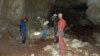 Исследователи в пещере возле поселка Зуя
