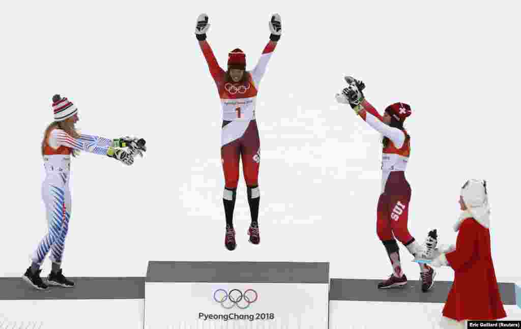 (Left to right): Alpine skiers Mikaela Shiffrin (United States, silver), Michelle Gisin (Switzerland, gold), and Wendy Holdener (Switzerland, bronze) celebrate getting a podium finish at the Winter Olympics in Pyeongchang, South Korea. (Reuters/Eric Gaillard)