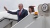 U.S. Vice President Mike Pence and his wife Karen Pence wave as they disembark from their plane after arriving in Tallin on July 30. 
