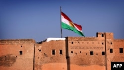 A Kurdish flag flying over the Irbil Citadel, in the capital of the autonomous Kurdish region of northern Iraq.