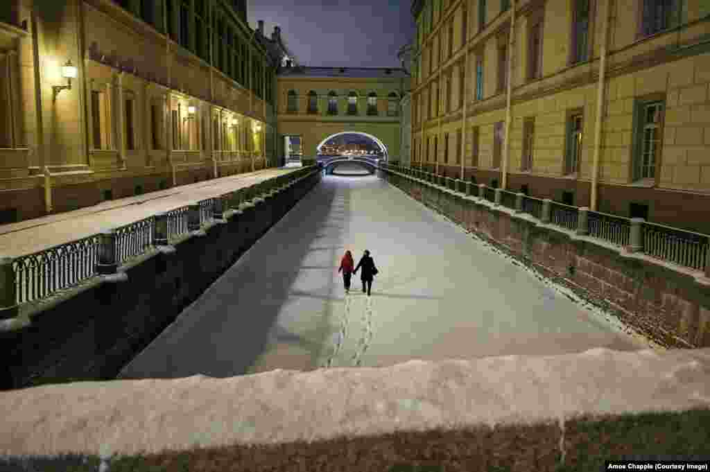 A couple walking on the frozen Winter Canal in the city center. Petrosyan said this picture came at the end of a long, unsuccesful night shooting a snowstorm. He was on his way home when the couple walked out from a bridge beneath him. Petrosyan remembers the moment as "unexpected and beautiful, like a dream."