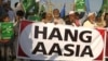 FILE: Hard-line Islamist protesters call for the execution of Christian Asia Bibi after she was acquitted in 2018.