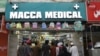 People line up at a pharmacy following the announcement to lock down Sindh Province amid concerns over the spread of the coronavirus, in Karachi, on March 22.