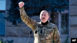 Azerbaijani President Ilham Aliyev delivers a speech during a parade in Khankendi, also known by Armenians as Stepanakert, Nagorno-Karabakh, on November 8.