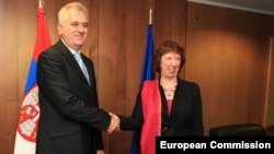 Catherine Ashton (left) and Tomislav Nikolic finally meet on June 14 -- all's well that ends well.