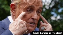 U.S. -- U.S. President Donald Trump's personal lawyer, Rudolph Giuliani, speaks to reporters at the White House in Washington, July 1, 2020