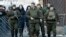 Separatist leader Aleksandr Zakharchenko (center) walks with bodyguards in the center of Donetsk on January 22.