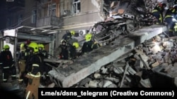 Rescuers work at the site of an apartment building hit during overnight Russian drone strikes in Odesa, Ukraine, on January 27.