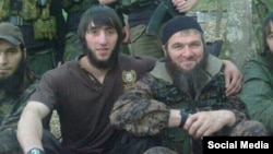 Veteran Chechen militant "Yahya" (left) poses with Caucasusu Emirate leader Doku Umarov.