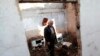 Sava Knezevic, 65, walks through his house in the Croatian town of Knin, destroyed during the Balkan wars of the early 1990s.