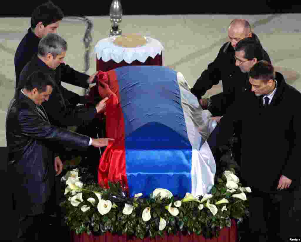 On March 12, 2003, a sniper connected to an ultranationalist police unit shot Djindjic in broad daylight outside a government building. Here, close friends and colleagues pay their last respects at the St. Sava church in Belgrade on March 15. 