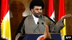 Iraq -- Shi'ite cleric Moqtada al-Sadr speaks during a press conference in the northern Kurdish city of Irbil, 26Apr2012