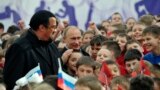 RUSSIA -- Russian President Vladimir Putin, second left, and U.S. movie actor Steven Seagal, left, visit a new sports arena in Moscow, March 13, 2013