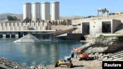 Employees work at strengthening the Mosul dam in northern Iraq on February 3.