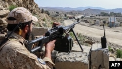 A Taliban soldier guards a road near the Ghulam Khan zero-point border crossing between Afghanistan and Pakistan in Gurbuz district in the southeast of Khost Province on October 20, 2025.