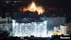 Flames rise after an attack by Israeli forces in the southern suburbs of Beirut on March 13.
