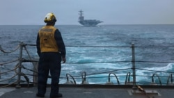 A US sailor stands on the flight deck on the USS Mason near the Strait of Hormuz earlier this month.