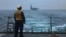 A US sailor stands on the flight deck on the USS Mason near the Strait of Hormuz earlier this month.