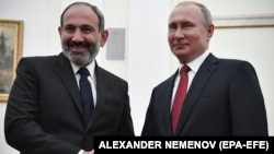 RUSSIA -- Russian President Vladimir Putin (Right) shakes hands with Armenian Prime Minister Nikol Pashinian (Left) during their meeting in the Kremlin in Moscow, Russia, 27 December 2018