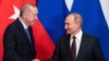 RUSSIA -- Russian President Vladimir Putin and Turkish President Tayyip Erdogan shake hands during a news conference following their talks in Moscow, March 5, 2020