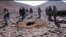A video shows men stoning a woman in a hole to death in Afghanistan's Ghor province on October 25.
