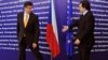 European Commission President Jose Manuel Barroso (right) welcomes Czech Prime Minister Jan Fischer to EU headquarters in Brussels on October 13.