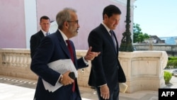 Portuguese Foreign Minister Paulo Rangel (left) and US Secretary of State Marco Rubio leave after their joint press conference and meeting in Lisbon on October 8. 