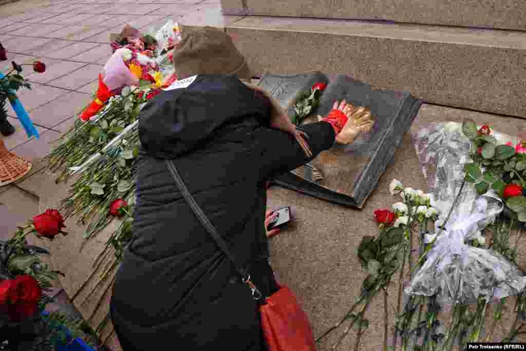 A young woman at Almaty&#39;s Independence Monument.&nbsp;