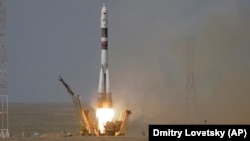 A Soyuz-FG rocket booster with a Soyuz MS-09 spaceship carrying a new crew to the International Space Station blasts off at the Russian-leased Baikonur cosmodrome on June 6.