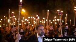 Armenia - A torchlight procession march during a demonstration to mark the 106th anniversary of the Armenian Genocide, in Yerevan, April 23, 2021.