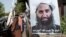 Poster of Taliban spiritual leader Haibatullah Akhundzada along a road in Kabul.