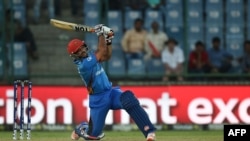 Shafiqullah Shafaq plays a shot during the World T20 cricket tournament match between England and Afghanistan at Feroz Shah Kolta Cricket Stadium in New Delhi in March 2016.