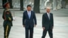File photo of Afghanistan's President Ashraf Ghani (R) and Chinese President Xi Jinping.