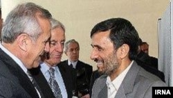 Iranian President Mahmud Ahmadinejad (right) with his Lebanese counterpart, Michel Suleiman, in Tehran on November 24.