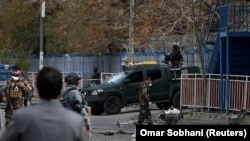 AFGHANISTAN -- Afghan security forces inspect the site of a blast in Kabul, November 12, 2018