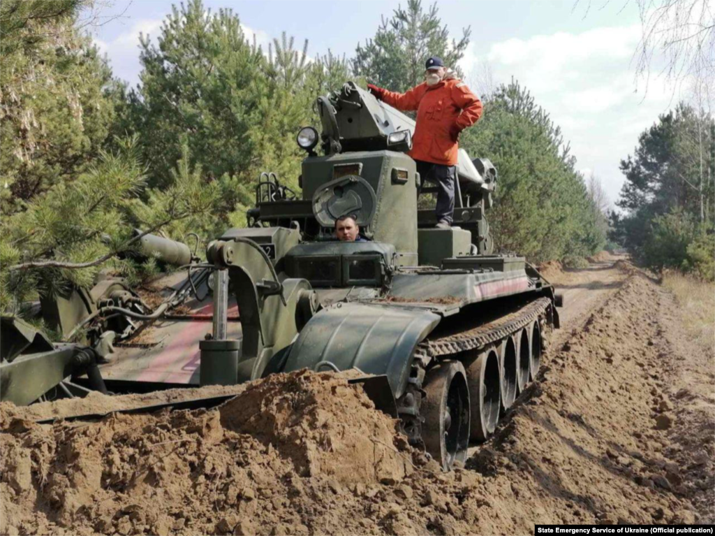 Heavy machinery plowed more than 100 kilometers of land in order to stop the spread of fire.